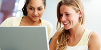 photo of women on computer